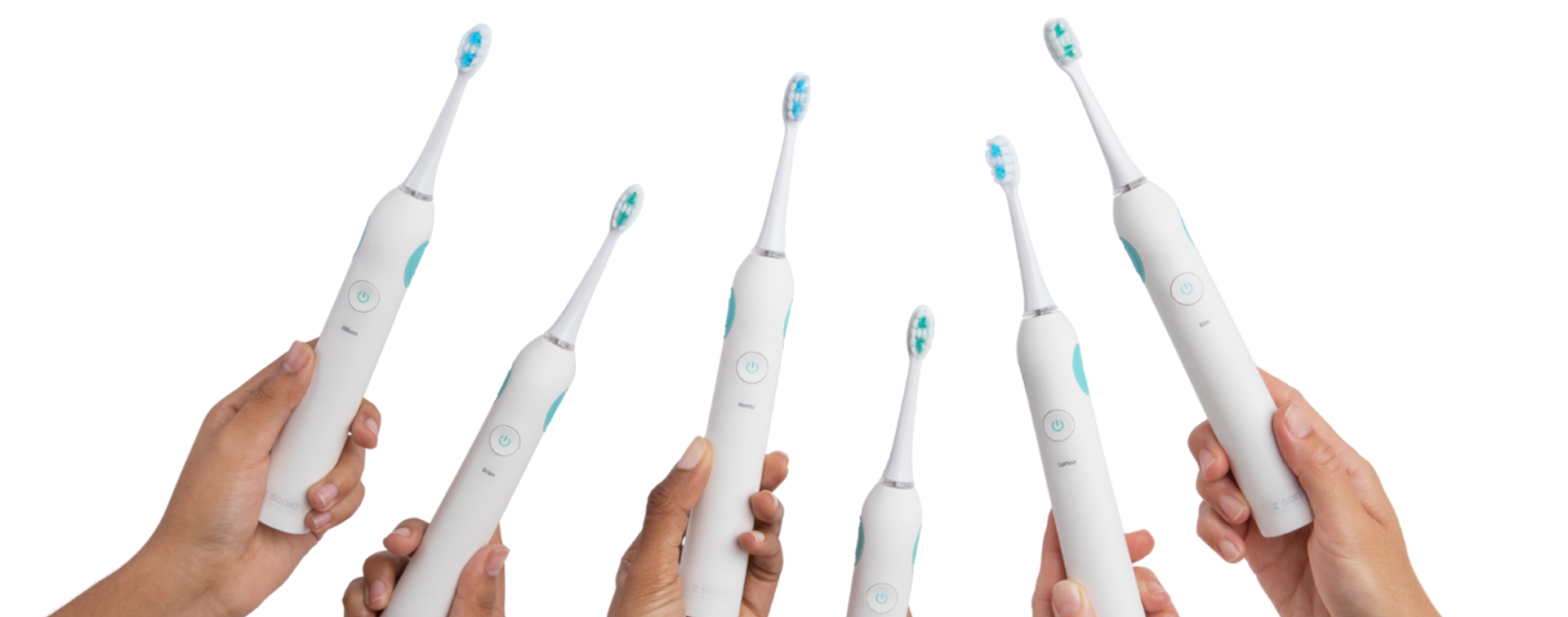 Z Sonic Pulse sonic toothbrushes held up in a lineup of hands